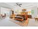 Spacious main bedroom with tray ceilings, seating area, and stylish decor at 340 Marietta Walk Ln, Marietta, GA 30064