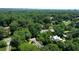 Lush, green trees surround a home, creating a private oasis with a picturesque park nearby and city skyline in distance at 468 W Paces Ferry Rd, Atlanta, GA 30305