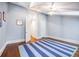 Spacious bedroom featuring a tray ceiling, hardwood floors and a large, colorful striped rug at 468 W Paces Ferry Rd, Atlanta, GA 30305