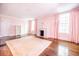 Airy bedroom featuring a marble fireplace, hardwood floors, and soft pink walls at 468 W Paces Ferry Rd, Atlanta, GA 30305