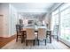 Bright dining room featuring hardwood floors, rug, farmhouse table and large windows with natural light at 468 W Paces Ferry Rd, Atlanta, GA 30305