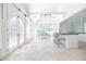 Bright kitchen and dining area featuring hardwood floors, large windows, and an island with seating at 468 W Paces Ferry Rd, Atlanta, GA 30305