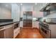 Modern kitchen featuring stainless steel appliances and white cabinetry at 468 W Paces Ferry Rd, Atlanta, GA 30305