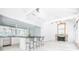 Open kitchen with island, stainless steel appliances, fireplace, and ample countertop space at 468 W Paces Ferry Rd, Atlanta, GA 30305