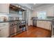 Modern kitchen boasting stainless steel appliances and ample cabinet space at 468 W Paces Ferry Rd, Atlanta, GA 30305