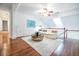 Light-filled living room with hardwood floors, white sofa, and a decorative metal coffee table at 468 W Paces Ferry Rd, Atlanta, GA 30305