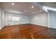 Bright living room with hardwood floors, recessed lighting, and large windows with shutters at 468 W Paces Ferry Rd, Atlanta, GA 30305