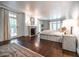 Spacious main bedroom featuring hardwood floors, fireplace, recessed lights, french doors, and neutral decor at 468 W Paces Ferry Rd, Atlanta, GA 30305