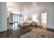 Large main bedroom featuring hardwood floors, recessed lights, french doors, fireplace, and walk in closet at 468 W Paces Ferry Rd, Atlanta, GA 30305