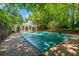 A covered pool in the backyard provides a private retreat in a lush setting at 468 W Paces Ferry Rd, Atlanta, GA 30305