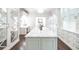 Spacious walk-in closet with custom island, marble countertop, and mirrored doors at 468 W Paces Ferry Rd, Atlanta, GA 30305