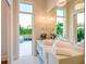 Elegant bathroom with a vessel sink, modern lighting, a large mirror, and access to outdoor seating at 0 Ebenezer Rd, Fayetteville, GA 30215