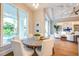 Bright dining area features a round table, chairs, hardwood floors, and a view of the outdoor pool at 0 Ebenezer Rd, Fayetteville, GA 30215