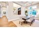 Formal dining room with large windows and modern lighting adjacent to entry hall at 0 Ebenezer Rd, Fayetteville, GA 30215