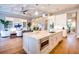 Open concept kitchen with stone countertops and stainless appliances flows to living area at 0 Ebenezer Rd, Fayetteville, GA 30215