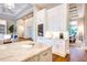 Gourmet kitchen with white cabinetry, island, and open layout into living areas at 0 Ebenezer Rd, Fayetteville, GA 30215