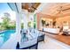 Spacious living room with a view of the pool, comfortable seating, and stylish decor at 0 Ebenezer Rd, Fayetteville, GA 30215