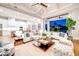 Bright living area with vaulted ceilings, modern furnishings, and sliding glass doors to outdoor space at 0 Ebenezer Rd, Fayetteville, GA 30215