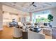 Inviting living room featuring modern furniture, an open kitchen view, and wood flooring throughout at 0 Ebenezer Rd, Fayetteville, GA 30215
