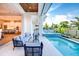 Relaxing outdoor patio with comfortable seating, a pool, and a view of the lush backyard at 0 Ebenezer Rd, Fayetteville, GA 30215