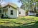 Exterior shot of backyard with grass and exterior buildings at 2453 Fernleaf Ln, Decatur, GA 30033