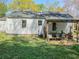 View of the rear exterior with a covered porch at 2453 Fernleaf Ln, Decatur, GA 30033