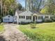 Quaint one-story home with detached garage and inviting curb appeal at 2453 Fernleaf Ln, Decatur, GA 30033