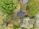 Aerial view of a home surrounded by mature trees and lush greenery at 2740 Flagstone Se Dr, Atlanta, GA 30316