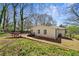 Scenic backyard with a wooden bridge leading to the property's entrance at 2740 Flagstone Se Dr, Atlanta, GA 30316