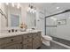 Bathroom featuring double sink vanity, modern shower and contemporary fixtures at 2740 Flagstone Se Dr, Atlanta, GA 30316
