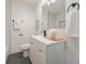 Bathroom with modern white cabinetry, updated fixtures, and decorative accents at 2740 Flagstone Se Dr, Atlanta, GA 30316