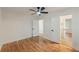 Bright bedroom featuring hardwood floors, a ceiling fan, and easy access to the bathroom at 2740 Flagstone Se Dr, Atlanta, GA 30316