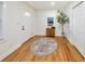 Bright entryway featuring hardwood floors, a decorative rug, and a charming front door at 2740 Flagstone Se Dr, Atlanta, GA 30316
