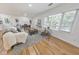 Cozy living room with large windows, comfortable seating, and hardwood floors at 2740 Flagstone Se Dr, Atlanta, GA 30316