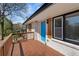 Charming, renovated home featuring a bright blue front door and a wooden porch with railings at 2740 Flagstone Se Dr, Atlanta, GA 30316