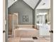 Bathroom featuring tiled floors, a tub, a shower and white cabinetry at 5848 Deer Crossing Dr, Sugar Hill, GA 30518