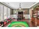 Well-lit bonus room featuring hardwood floors, stylish decor, and ample space for play at 5848 Deer Crossing Dr, Sugar Hill, GA 30518