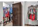 Walk-in closet with storage shelves and hanging rods for ample space at 5848 Deer Crossing Dr, Sugar Hill, GA 30518