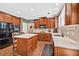 Well-appointed kitchen with island, stainless appliances, and ample counter space at 5848 Deer Crossing Dr, Sugar Hill, GA 30518