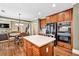 Open kitchen with large island, dual oven, and eat in dining area at 5848 Deer Crossing Dr, Sugar Hill, GA 30518