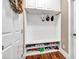Mud room features built-in storage, bench seating, and natural light at 5848 Deer Crossing Dr, Sugar Hill, GA 30518