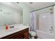 Bright bathroom featuring a shower-tub combination and single sink vanity at 112 Silver Fox Trl, Dallas, GA 30157