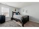Bedroom featuring a bed, dresser, and light-filled window at 112 Silver Fox Trl, Dallas, GA 30157