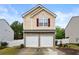 Charming home with a two-car garage, stone accents, and neutral siding on a bright day at 112 Silver Fox Trl, Dallas, GA 30157