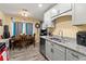 Kitchen with grey cabinets, granite counters, stainless appliances, dining area at 112 Silver Fox Trl, Dallas, GA 30157