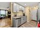Bright kitchen with grey cabinets, granite countertops, and modern appliances at 112 Silver Fox Trl, Dallas, GA 30157