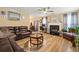 Open-concept living room featuring hardwood floors and fireplace at 112 Silver Fox Trl, Dallas, GA 30157