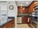 A modern kitchen featuring stainless steel appliances and dark granite countertops at 2285 Peachtree Ne Rd # 1207, Atlanta, GA 30309