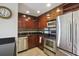 Updated kitchen with dark cabinets, stainless steel appliances, and modern fixtures at 2285 Peachtree Ne Rd # 1207, Atlanta, GA 30309