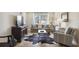 Cozy living room featuring a comfortable sofa, accent chair, and decorative rug at 2285 Peachtree Ne Rd # 1207, Atlanta, GA 30309